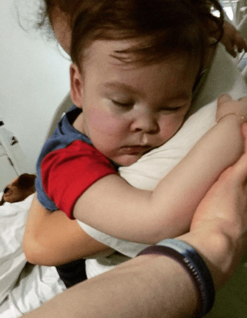  Alfie was shown cuddling his family after his life support was turned off on Monday