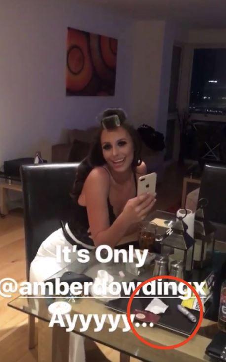  Axed Towie star Amber Dowding smiles for a picture that also appears to show a suspicious powder in the shot