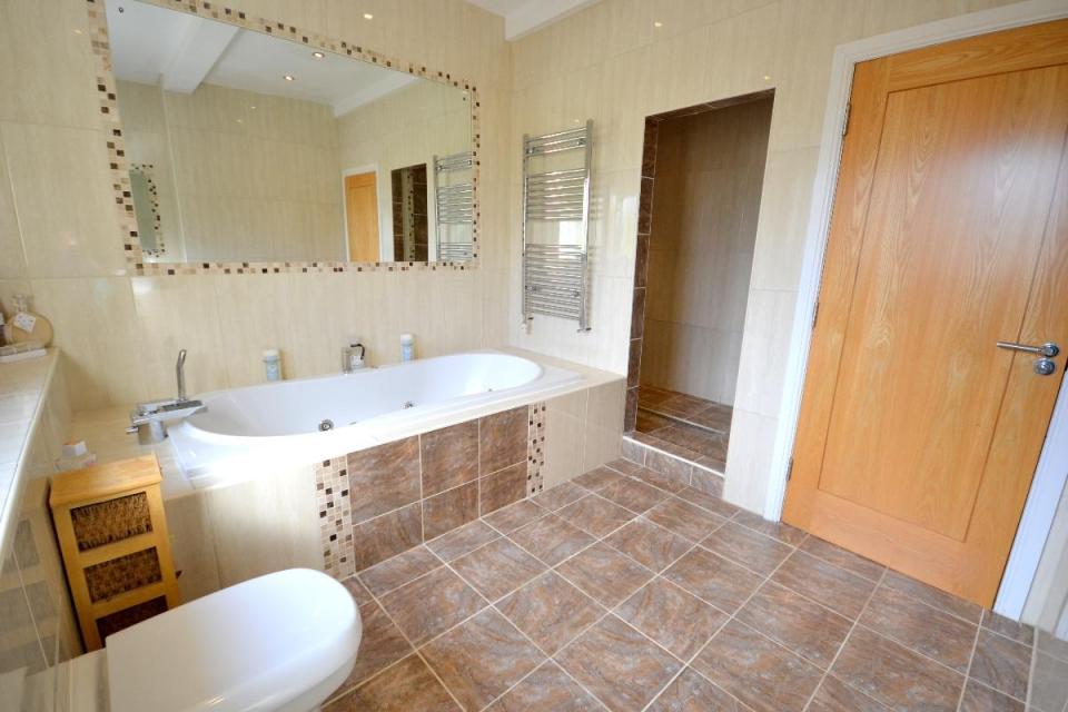  The main bathroom has a four-piece suite with a spa bath