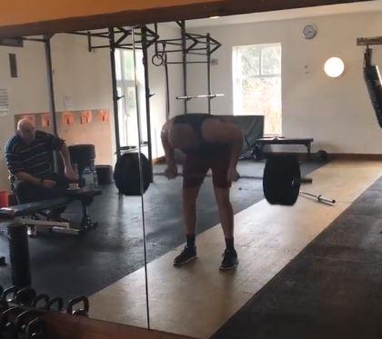  Fury does some bent over rows at the gym