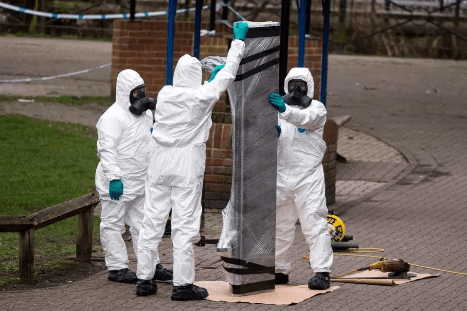 Forensic officers remove the bench where Skripal and his daughter were discovered in Salisbury