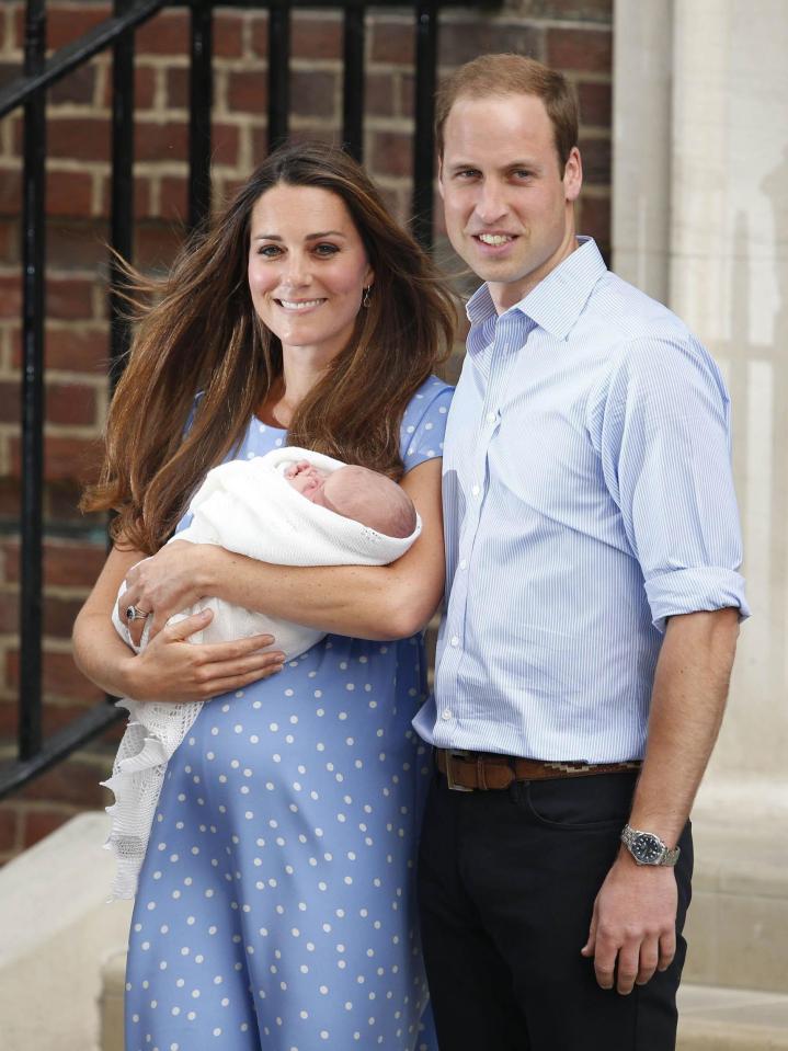  The proud parents posed in front of the steps to the Lindo wing following the arrival of Prince George in 2013