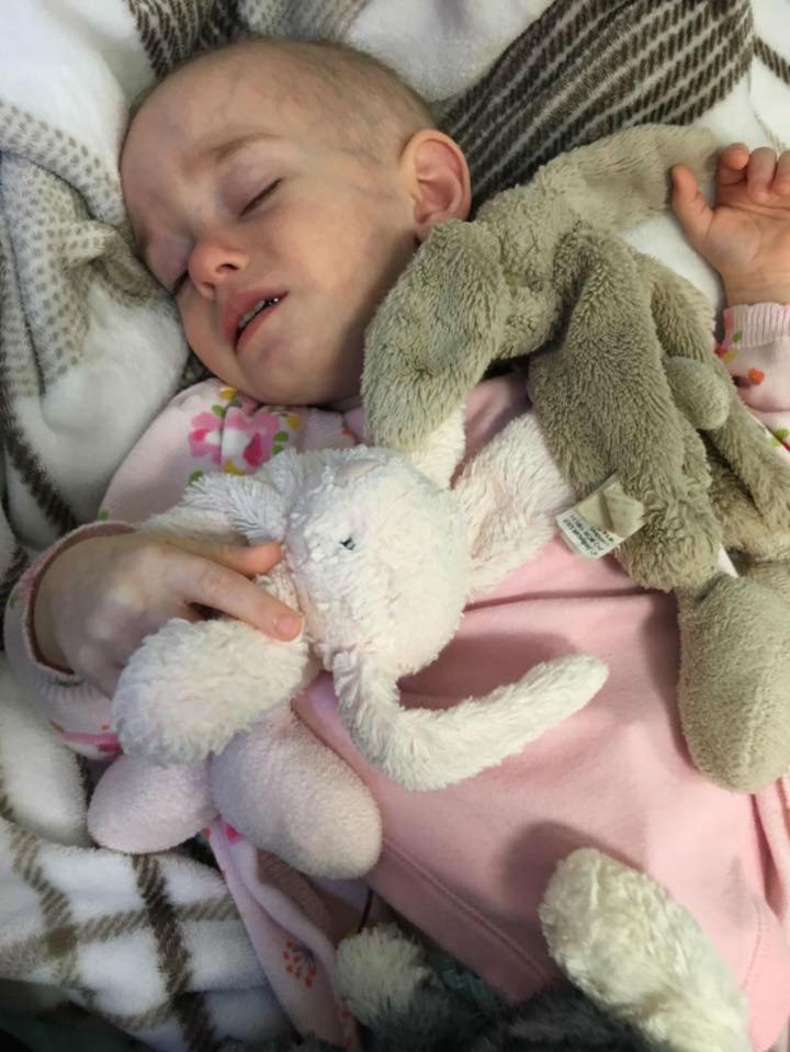  Poppy Martin, 2, suffers from neurofibromatosis type 1, which has caused a tumour to develop behind her eye, leaving her partially sighted