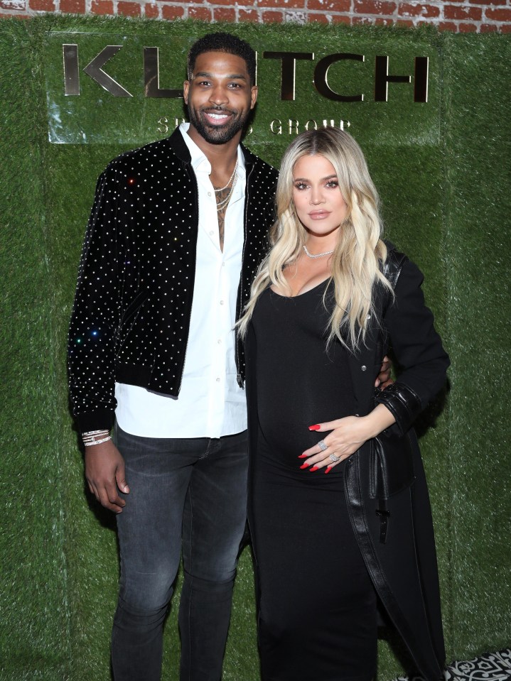 Tristan Thompson, pictured with his pregnant girlfriend Khloe Kardashian, was spotted 'kissing' a mystery brunette at a New York nightclub 