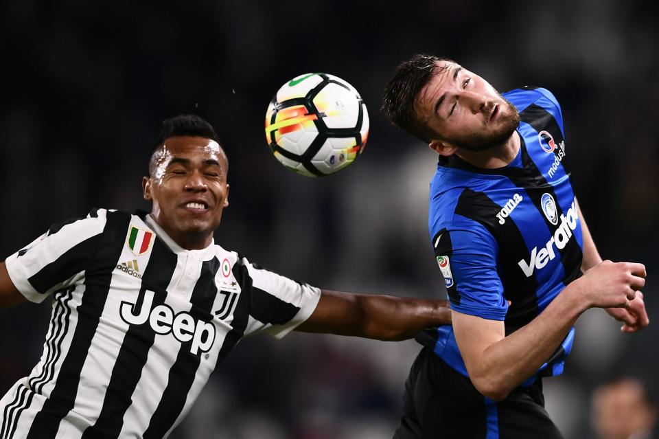  Sandro goes up for a header against Atalanta's Bryan Christante