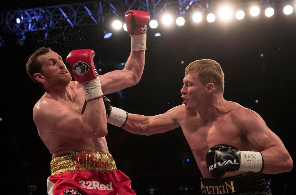  David Price is put on the back foot as Alexander Povetkin lunges forward