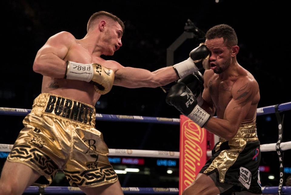  Ryan Burnett smashes his left hand into Yonfrez Parejo's face