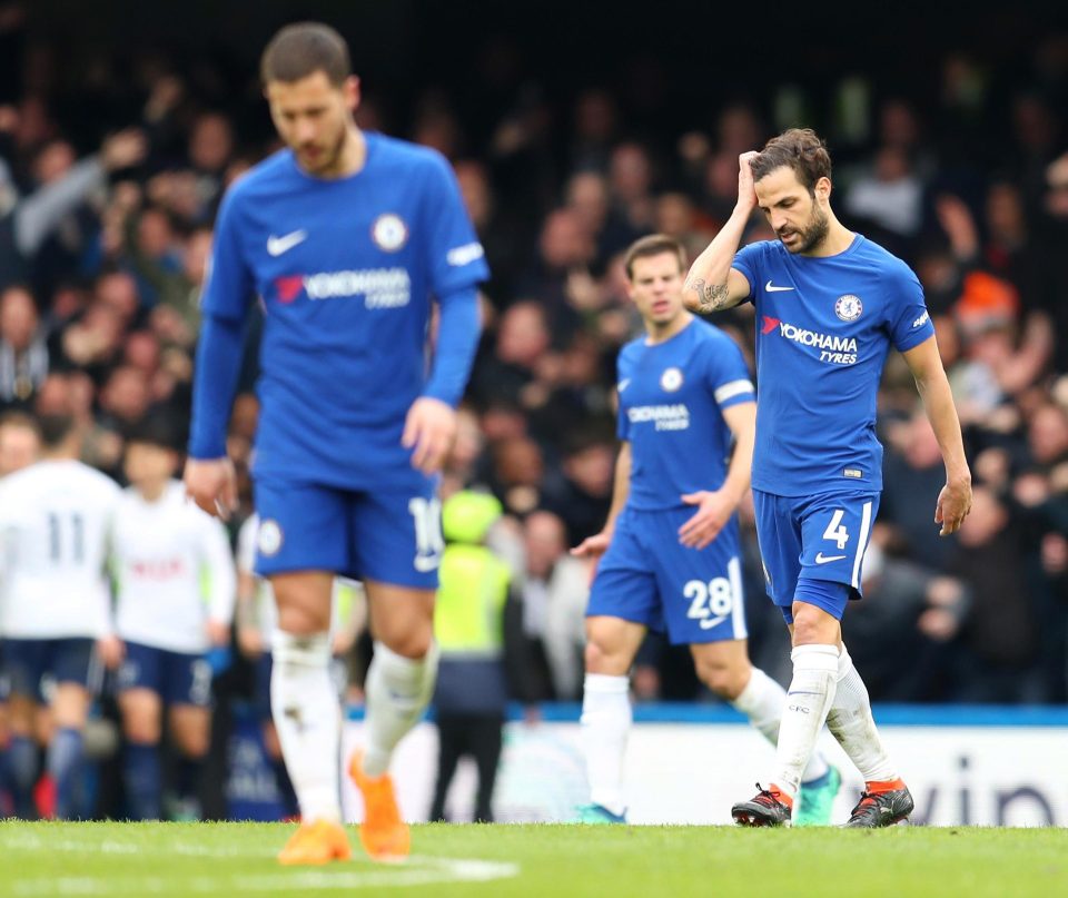  Chelsea players look dejected after they succumbed to a 3-1 defeat at the hands of their London rivals