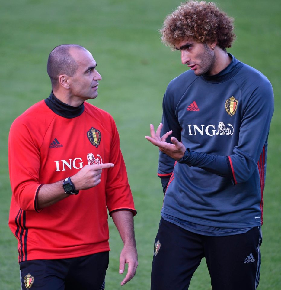  Fellaini chews the cud with his Belgian boss Roberto Martinez