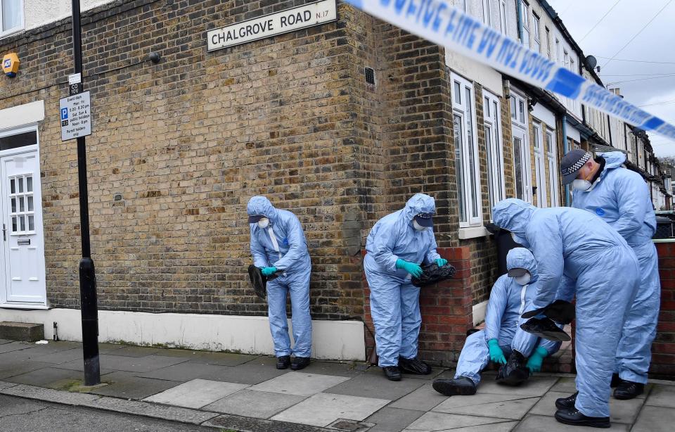  Forensic officers scour the street for clues after the death of the 17-year-old girl