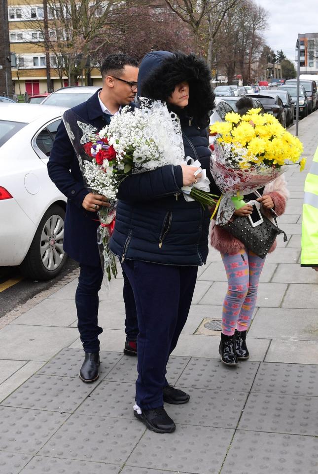  Tanesha's mum Sharon pictured at the scene of her murder holding flowers in tribute to her tragic daughter