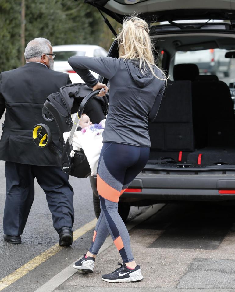  Ferne is a devoted mum to her daughter Sunday as she carefully puts her in the car