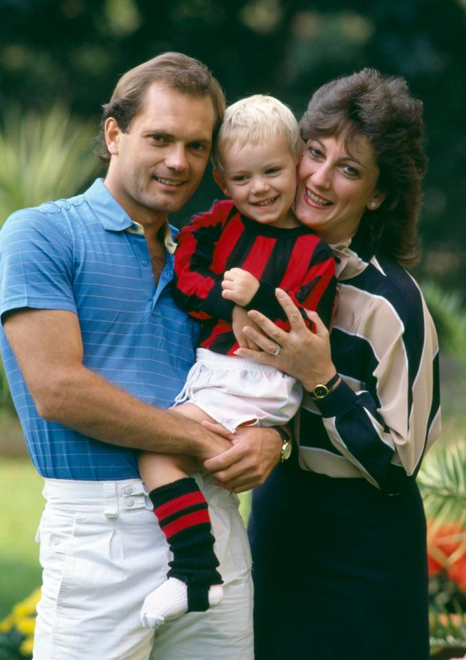  Wilkins and his wife Jackie hold their son Ross who's wearing the colours of his father's new club, AC Milan in Milan in September 1984