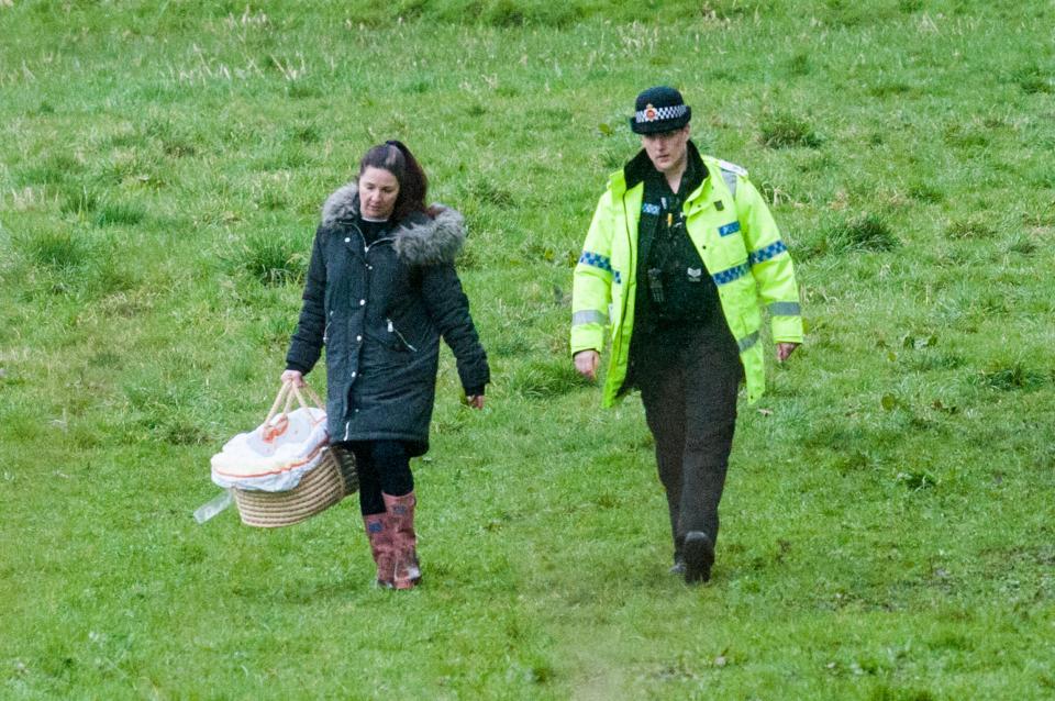  Officers were seen carrying a Moses basket in the area where the baby's body was discovered