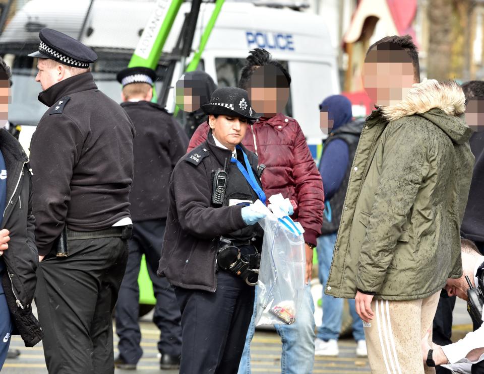  Officers pictured speaking to people the morning after the teen was murdered