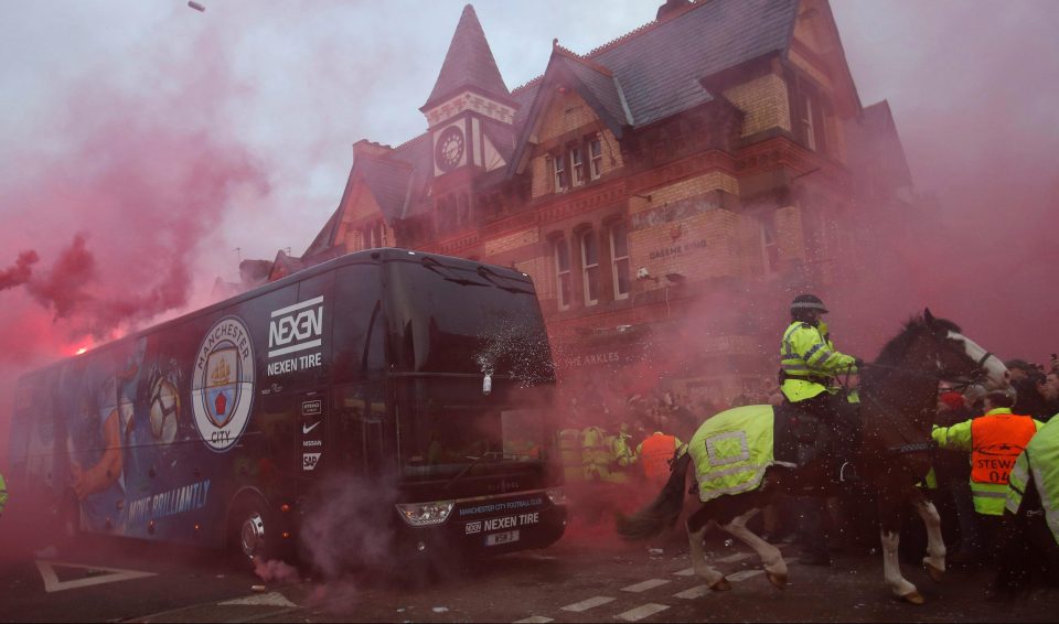  Liverpool fans threw missiles and let off fireworks at City bus outside Anfield