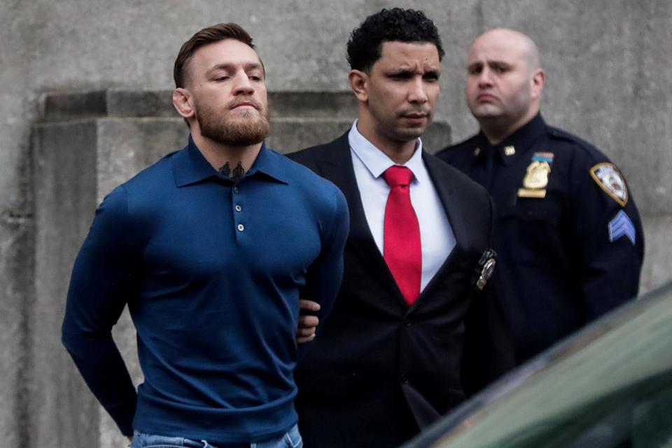  Conor McGregor has been charged with three assaults after he launched a trolley through a bus window at a UFC media day