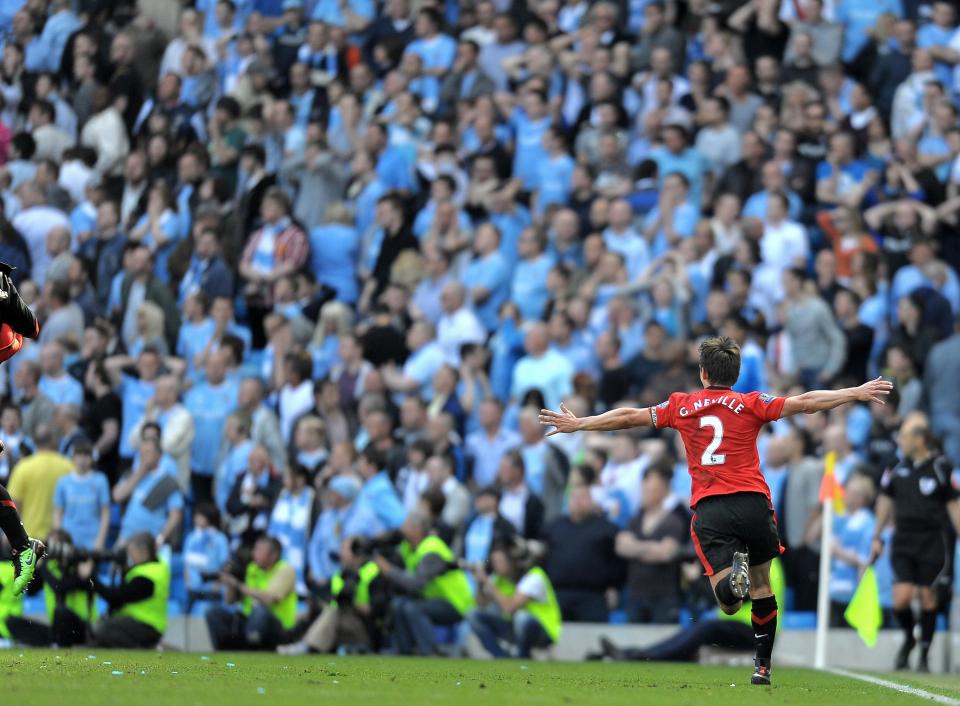  Gary Neville captioned the image of himself celebrating Paul Scholes 2010 derby winner: 'Don't lose FFS'