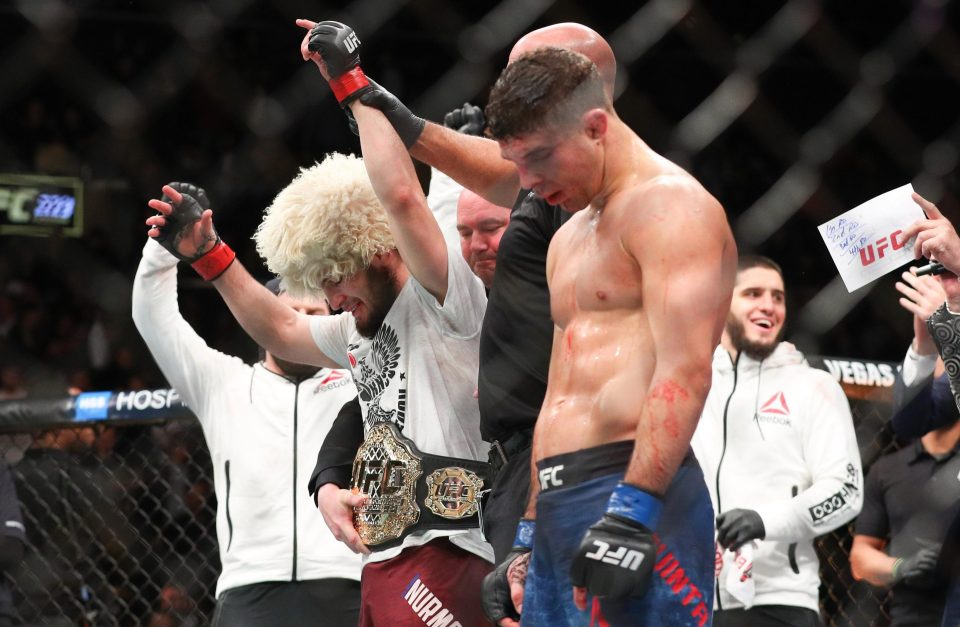  The undefeated Russian celebrates his latest win to clinch the UFC lightweight title