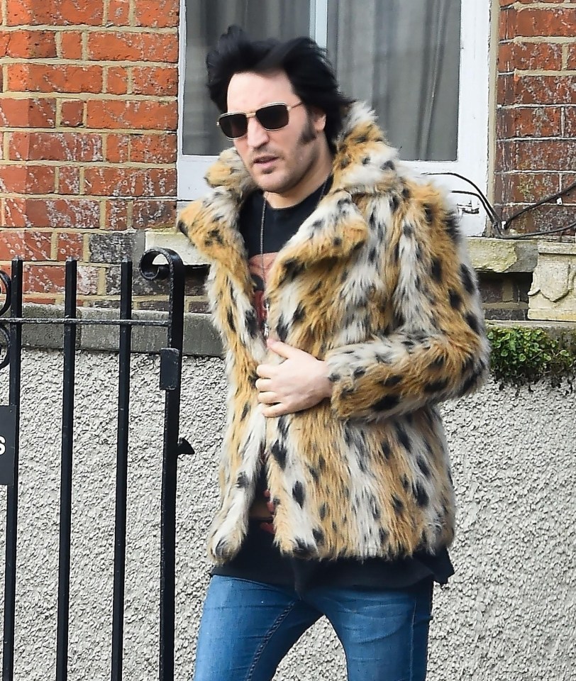 Noel wrapped up warm in a furry coat