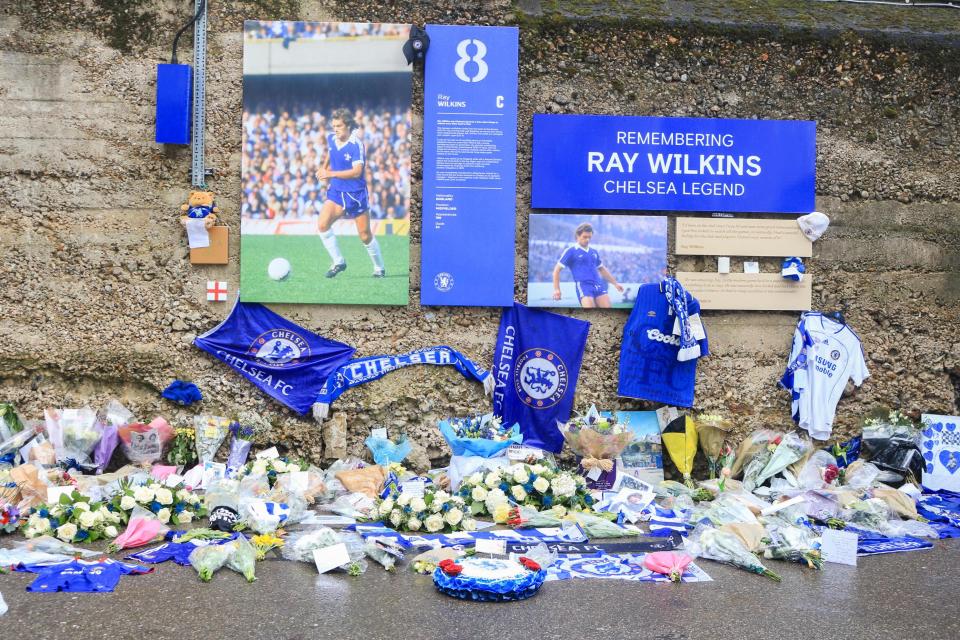  Fan laid flowers and messages ahead of the game for the late Ray Wilkins