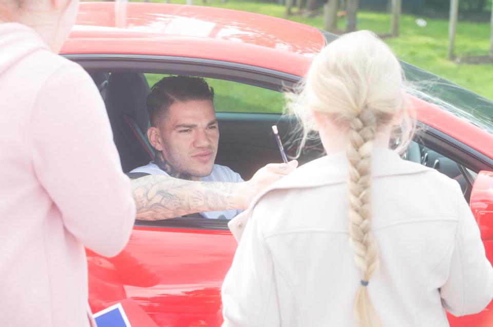  Ederson leans out of his Ferrari window to greet Man City supporters at Etihad