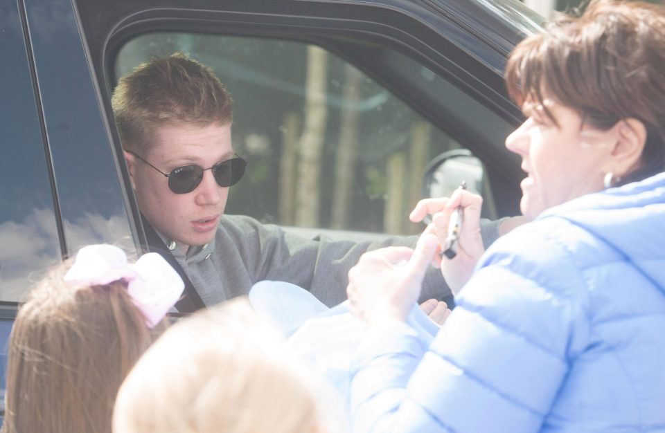  Belgium midfielder Kevin De Bruyne signs autographs - the day after he was just a substitute in City's shock 3-2 loss against Manchester United