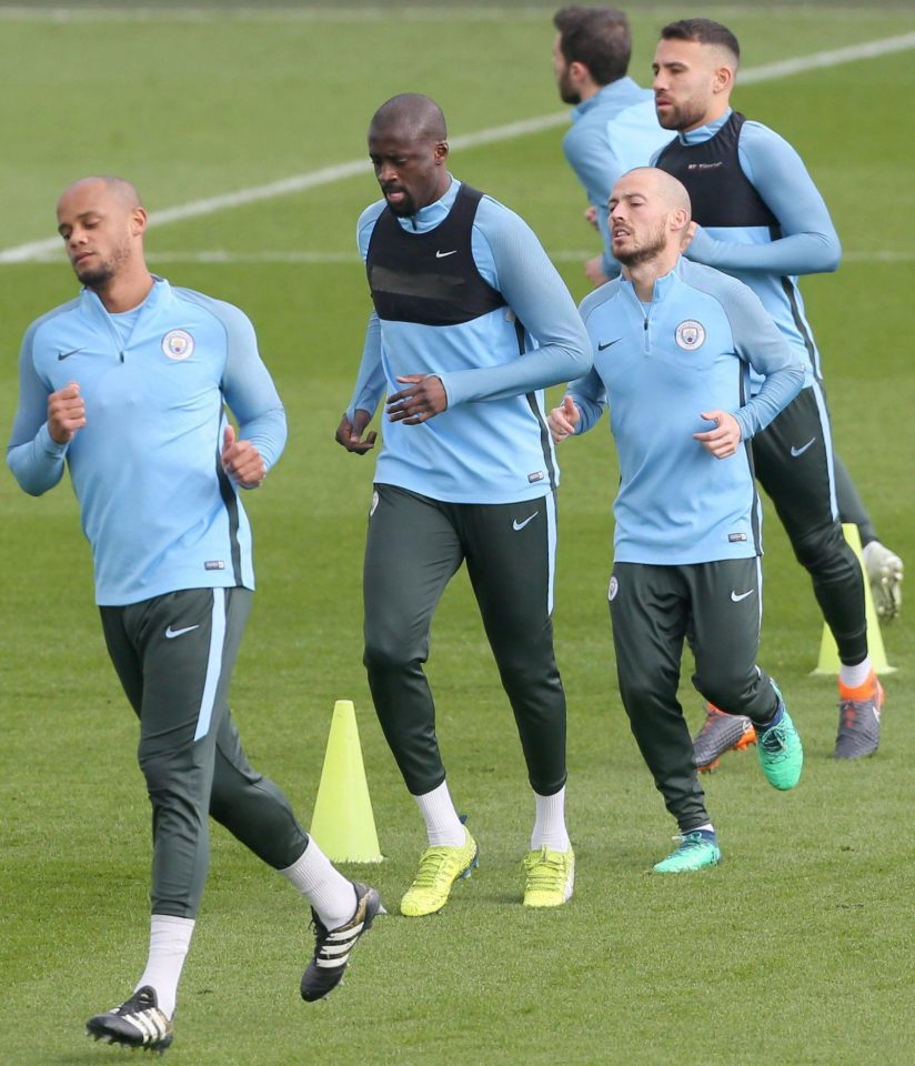  Vincent Kompany, Yaya Toure, David Silva and Nicolas Otamendi limber up to face the Reds