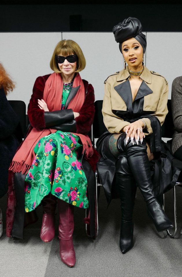  Cardi B, right, sitting next to American Vogue editor Anna Wintour, left, at an Alexander Wang fashion show