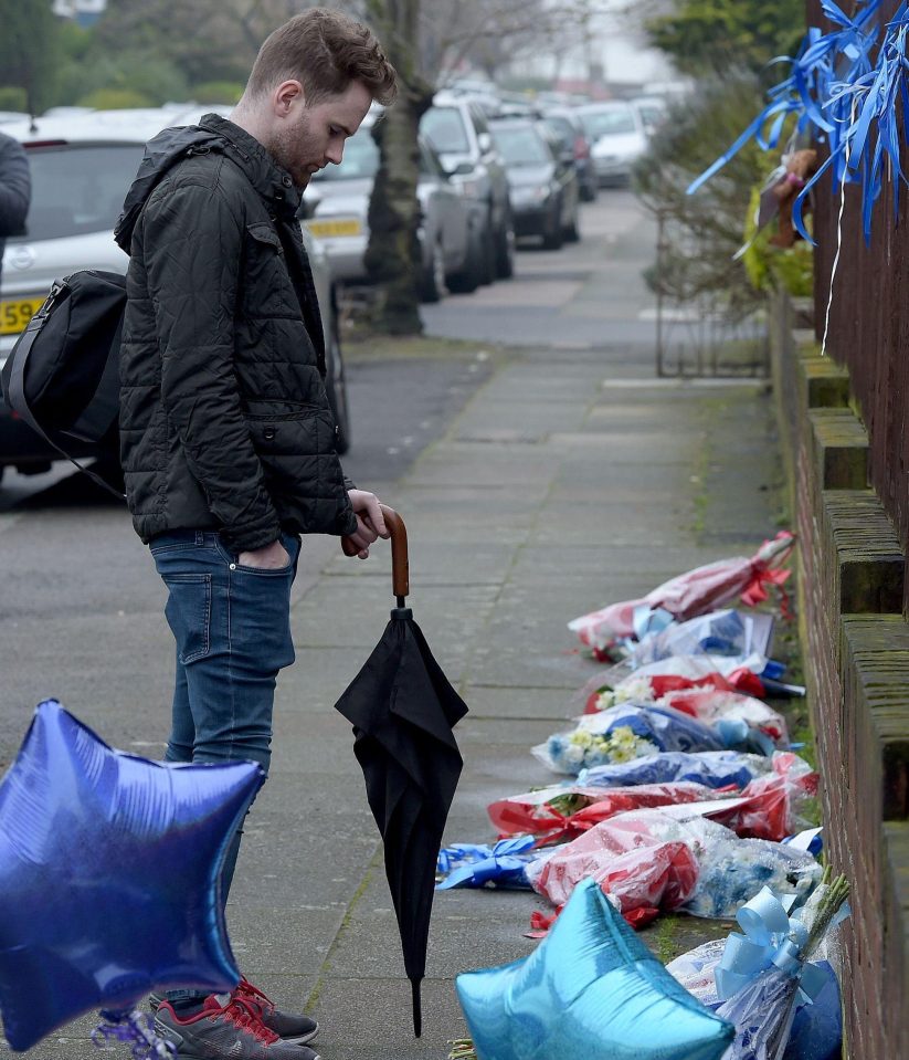  A man stands over the shrine today after it was dismantled overnight