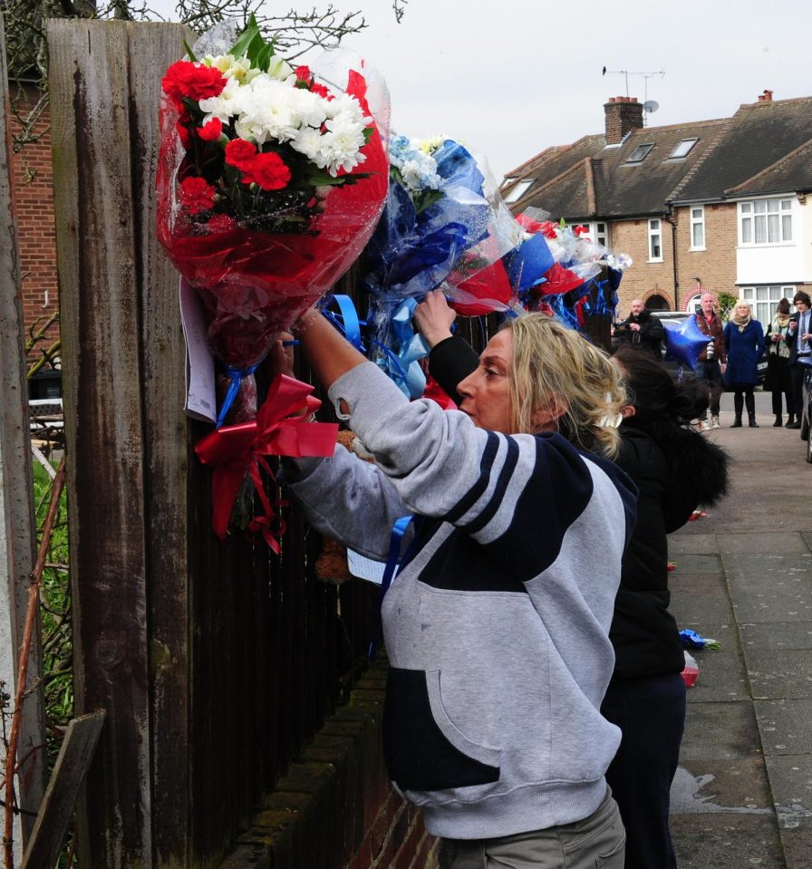  The first rebuilding of the shrine at 2.30pm this afternoon. Vincent's cousin Elvina Lee described the man who ripped the flowers down as 'scum'