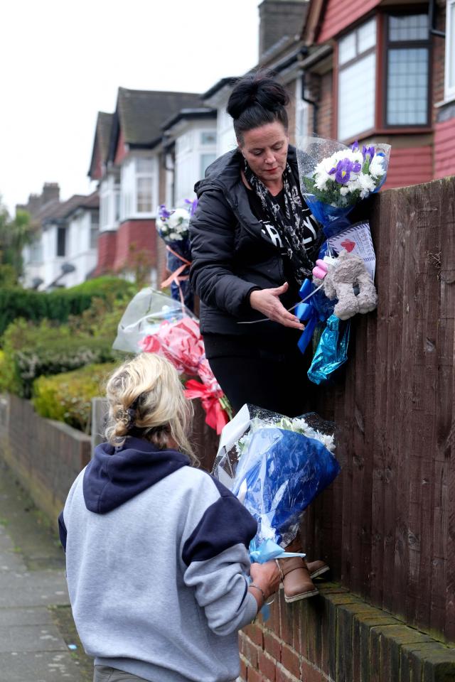  Family members returned for a second time to re-hang tributes after they were ripped down by vigilantes