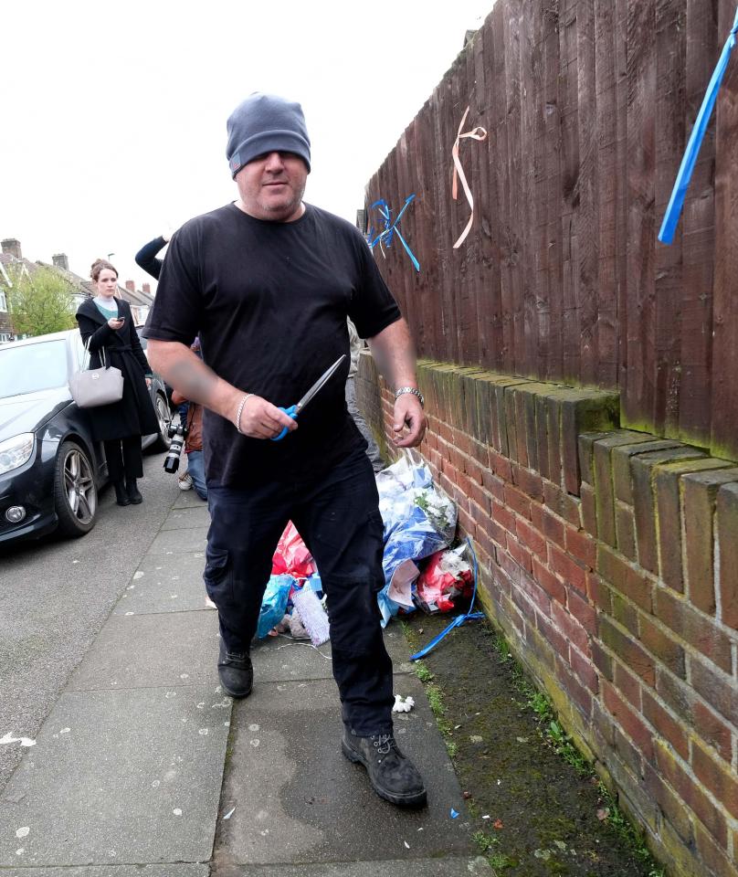  The man was filmed ripping down flowers and stamping on them