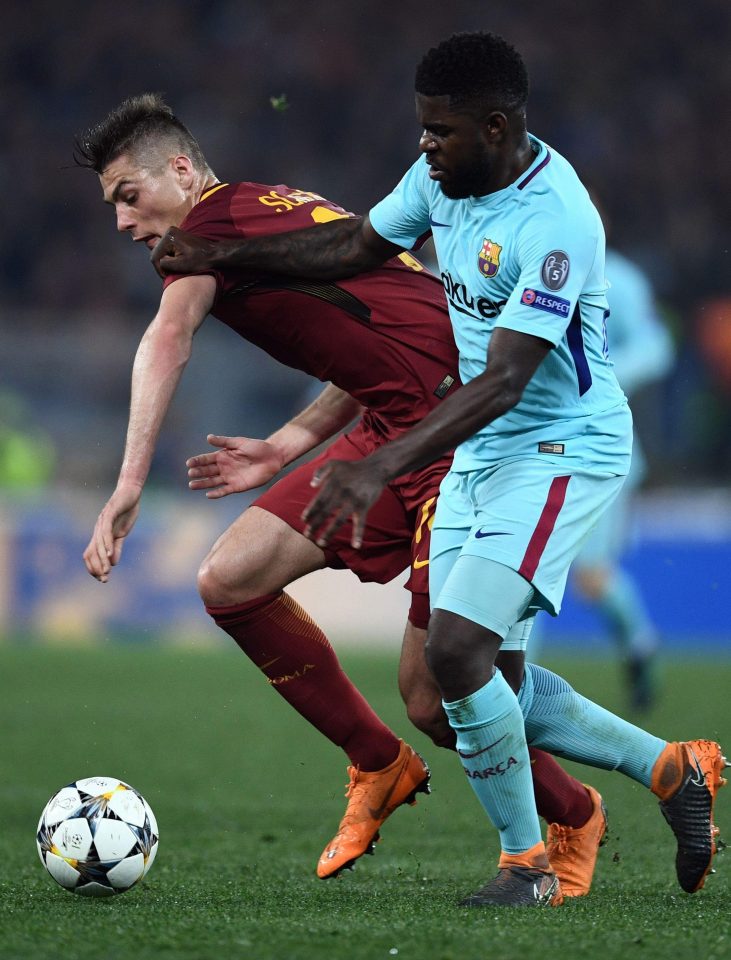  Roma's Czech forward Patrik Schick struggles to hold off Samuel Umtiti