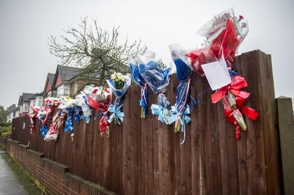  The vigilante left some flowers, pictured this morning, attached to the fence