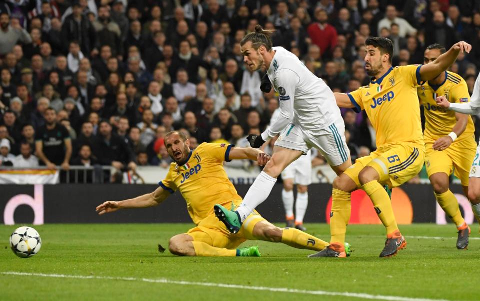  Bale in action with Giorgio Chiellini in Wednesday's Champions League match