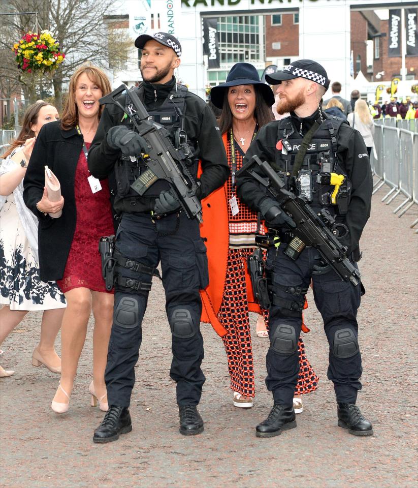  Armed police were patrolling at Aintree as festivalgoers enjoyed their day out