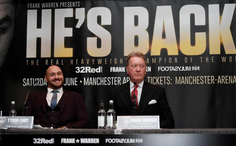  Tyson Fury sits next to promoter Frank Warren who claims he'll need three of four fights before he's back to his best