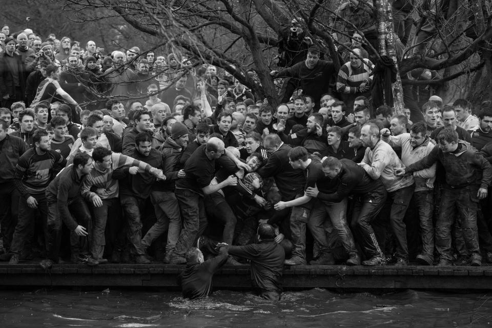  Two teams grappling for the ball in a historic Derbyshire football match were the subject of a finalist photograph in the sport category