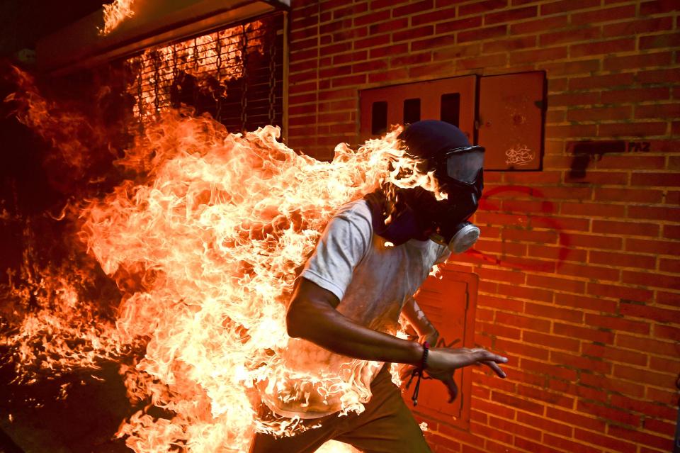  Ronaldo Schemidt was the winner of the World Press Photo of the Year with his photograph of a masked Venezuelan protester engulfed in flames