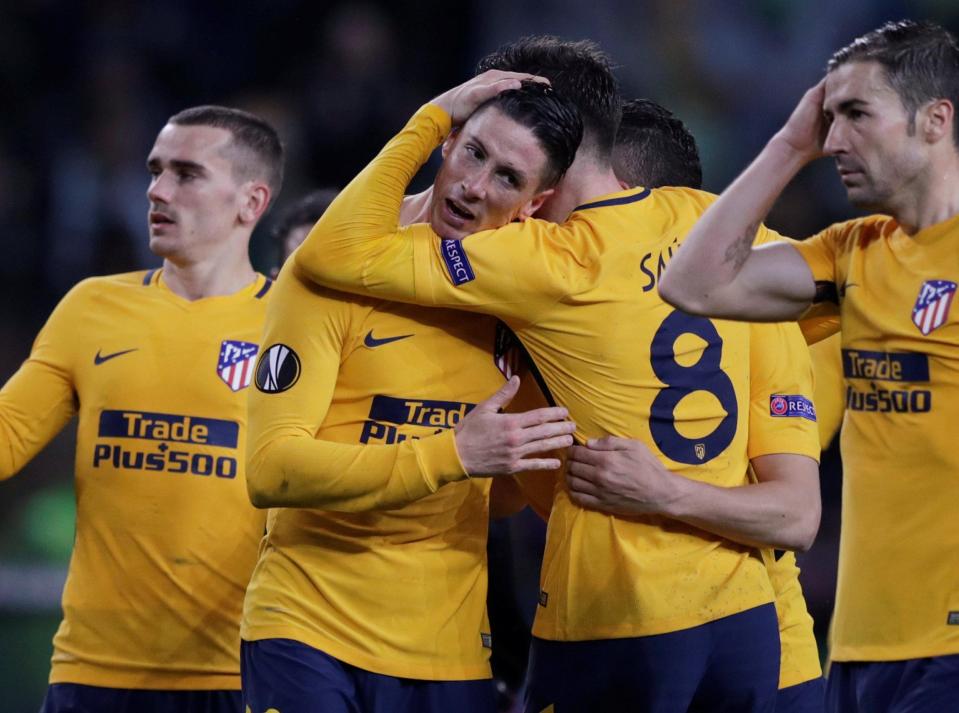  Fernando Torres and Saul Niguez after the final whistle