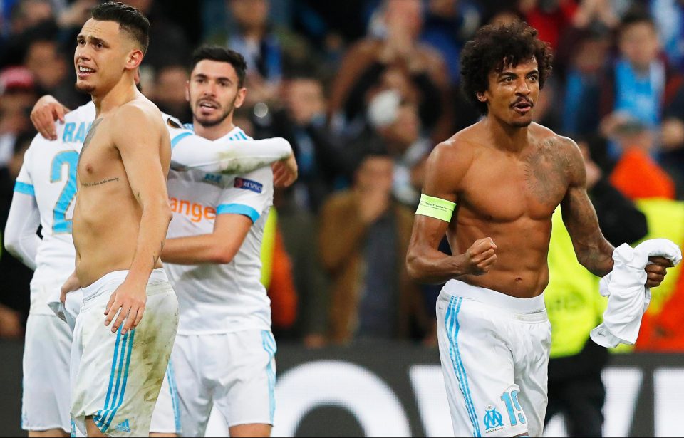  Luiz Gustavo leads the Marseille celebrations after what might go down as a famous night in their history