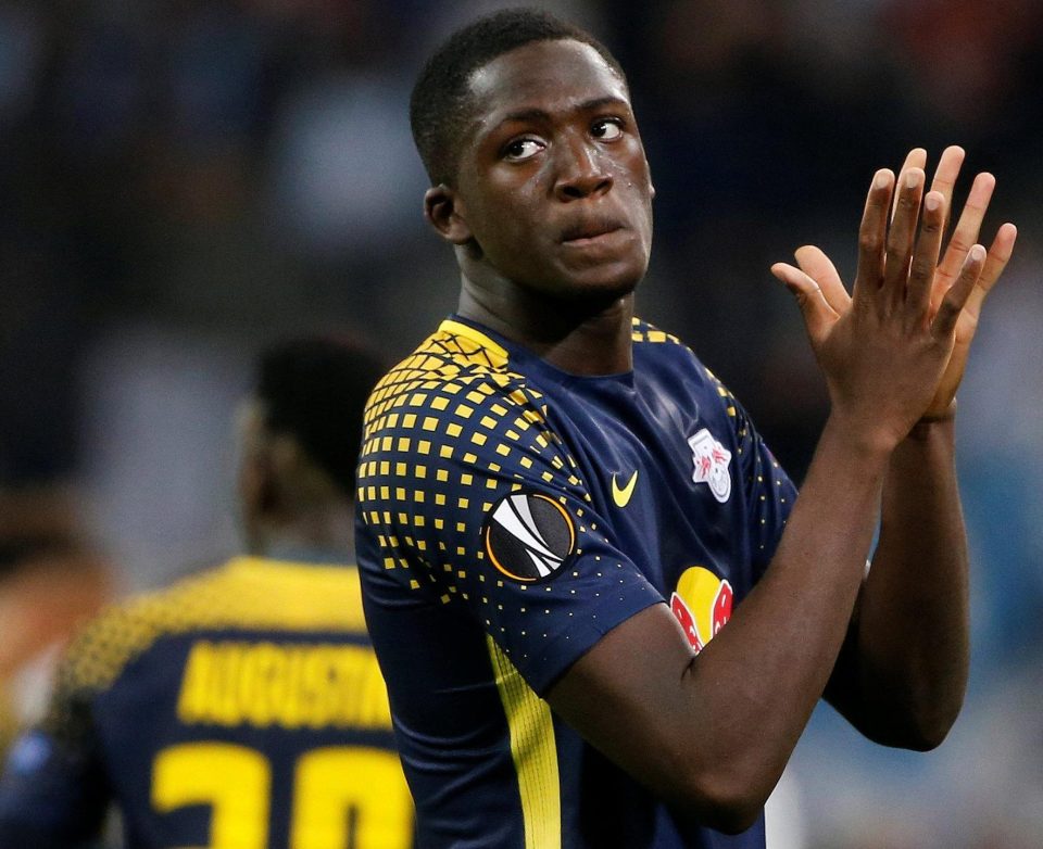  Ibrahima Konate shows the despair of Leipzig as he applauds their fans after the final whistle