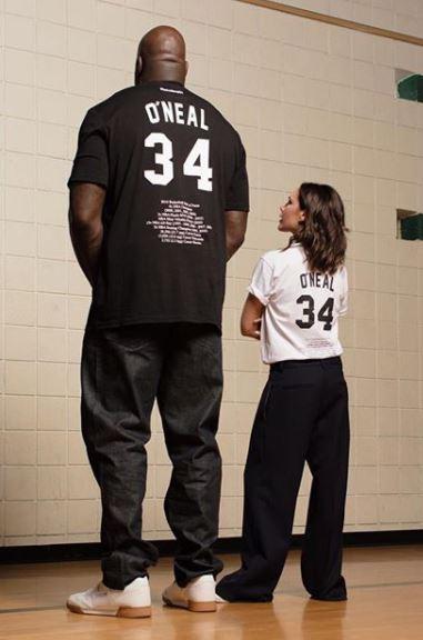  The 7'1" sports star hilariously towered over 5'4" Victoria during their photo call