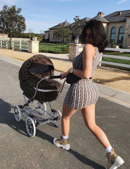  Kylie took a stroll wearing minidress matching her daughter's pram