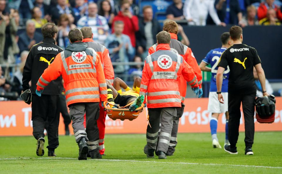  As he was being carried off the pitch on a stretcher, Michy Batshuayi covered his face with his hands