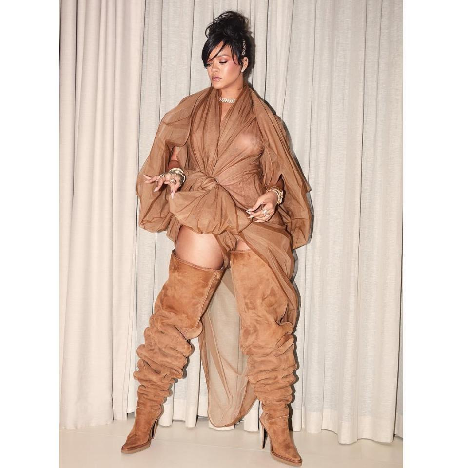  Rihanna wore oversized thigh-high ugg boots with a sheer wrap top in an unusual beige combination