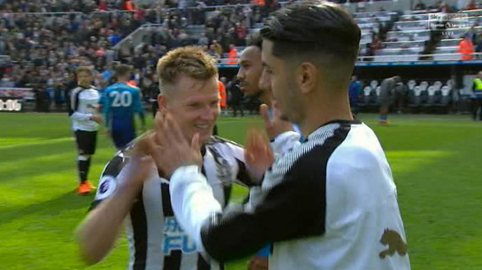  The two goalscorers congratulate each other as Pierre-Emerick Aubameyang walks on by