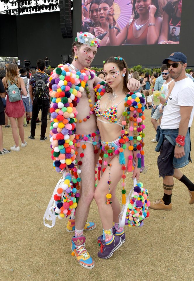  Modesty was covered by pompoms for this creative pair in their home-made outfits