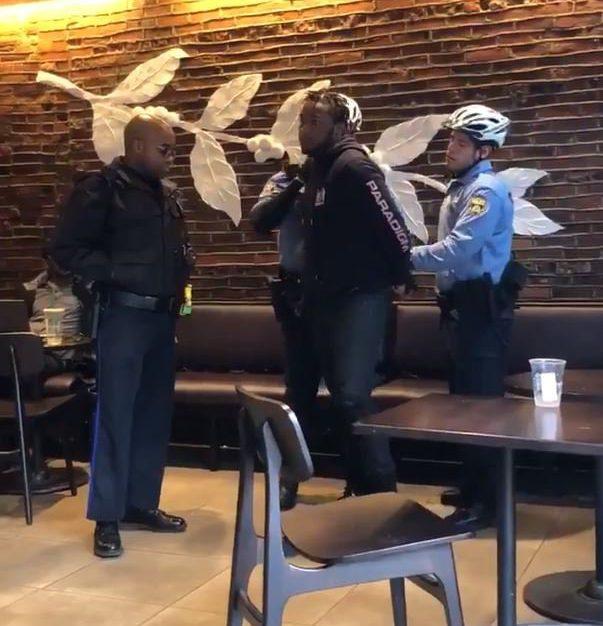  Witnesses in the Philadelphia store snapped the moment two black men were arrested because 'they didn't order anything'